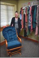 RACHEL HORTON displays clothing at Living Hope Pregnancy Center for young women looking forward to a new baby. The clothing boutique is open to any women who need help with maternity outfits. (Photo Everett Brazil, III)