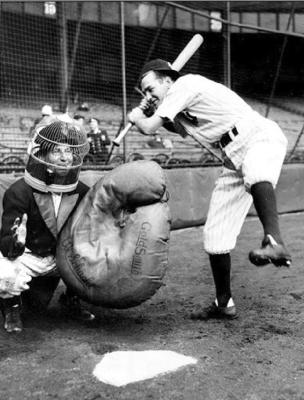 AL SCHACHT was one of baseball’s clown acts that delighted fans for years. Here he is behind the plate with a giant mitt and a birdcage on his head.