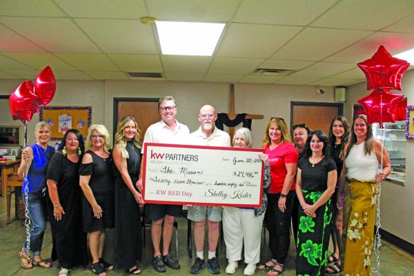 FOR RED Day, Keller-Williams made a donation in the amount of $27,486.50, which will serve to help in The Missions goal to provide help for people within the community. (Photo by Calley Lamar)
