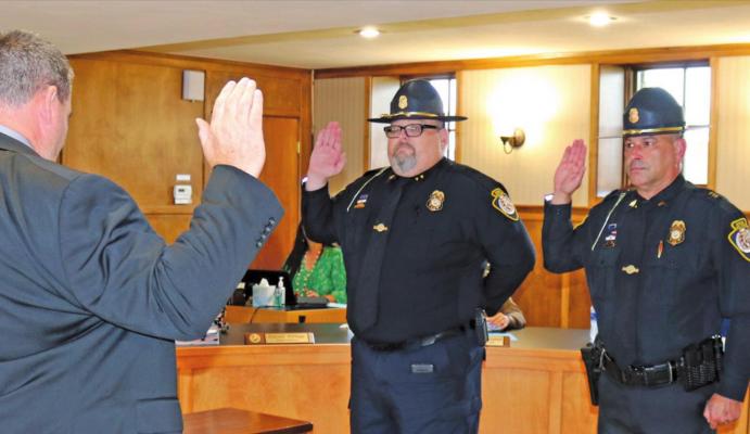 Three Otoe-Missouria Police Officers received their Special Law Enforcement Commissions with the Bureau of Indian Affairs Office of Justice Services Wednesday at the Otoe-Missouria Tribal Complex. Pictured from left to right are BIA Assistant Special Agent in Charge Bryan Stark who gave the oath to Chief David Mangrum and Officer Nick Alexy. Not pictured is Officer Jennings Gabriele.