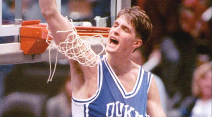 CHRISTIAN LAETTNER of Duke helps cut down the net after Duke won a national championship. Earlier in the tournament Laettner’s last second basket gave Duke a win over Kentucky.