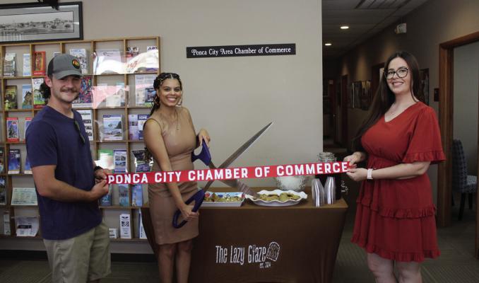 THE PONCA City Area Chamber of Commerce held a ribbon cutting ceremony for The Lazy Glaze, a home bakery business, on June 24 at 12:30 pm at the Chamber Office. The Lazy Glaze is owned by Cheyenne Harbeson (pictured cutting the ribbon), a stay-at-home mom who bakes a variety of treats, samples of which were shared at the ribbon cutting. (Photo by Calley Lamar)